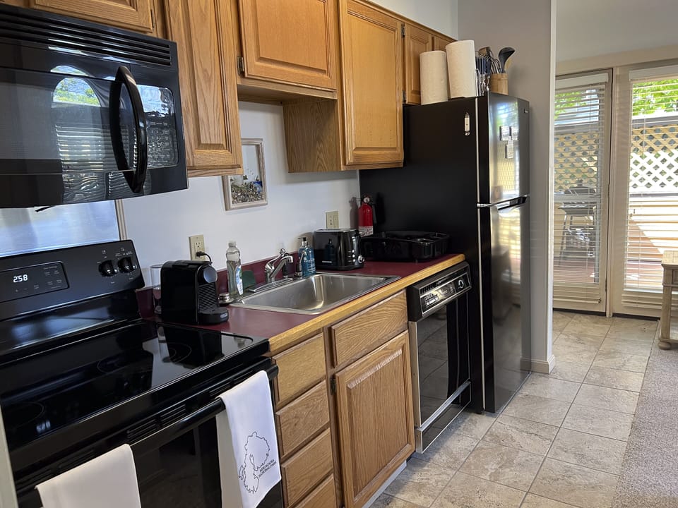Kitchenette with full-sized appliances.