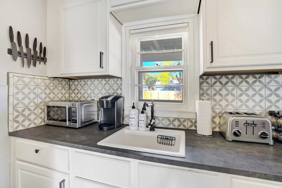 Fully stocked kitchen with a coffee maker, toaster, and all the essentials for easy meals at home.