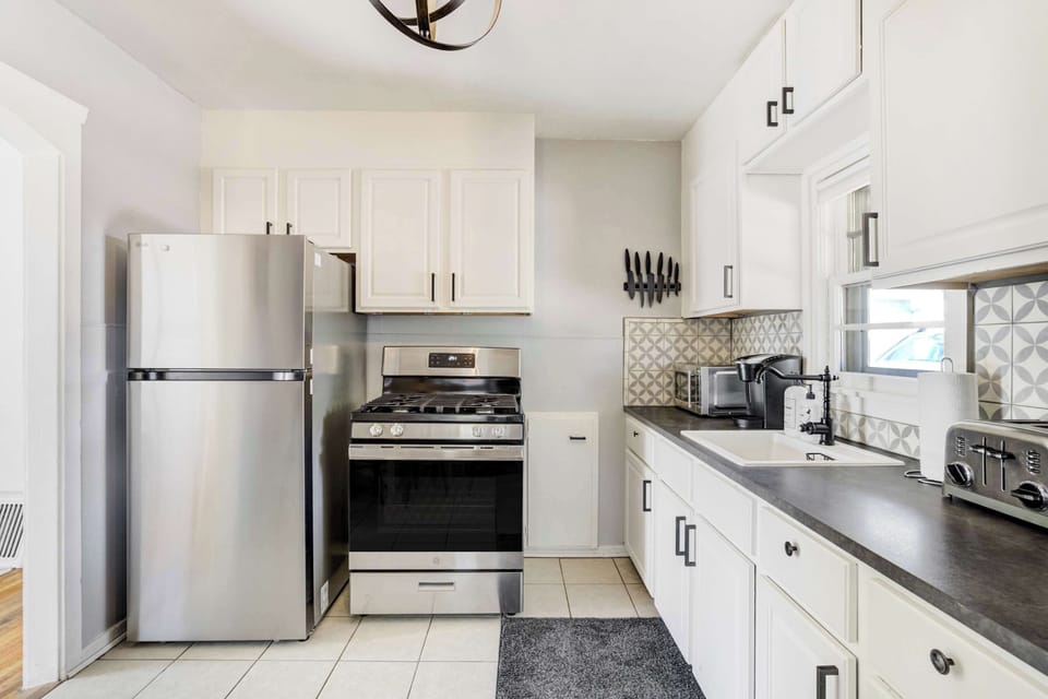 Bright and modern kitchen featuring stainless steel appliances, ample counter space, and thoughtful design.
