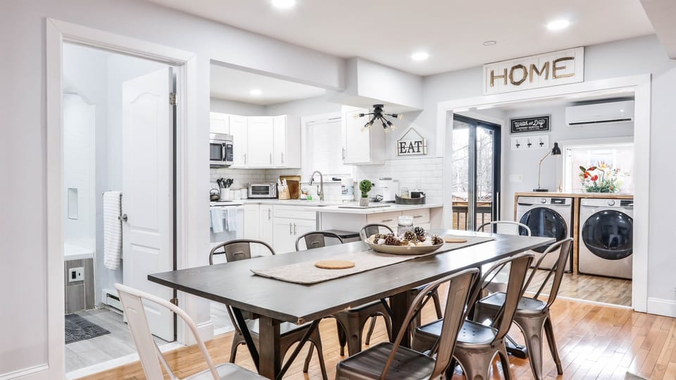 The house has an open concept dining area with seating for 8.