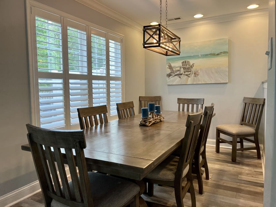 Dining area with table that can expand to seat 10.