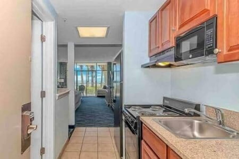 Walk-In View from the Kitchen to the Ocean  A full kitchenette and a straight sightline to the ocean