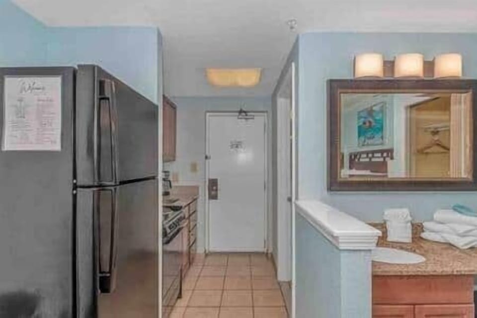 Bright entryway with full kitchenette, stocked for easy vacation meals and convenient access to the 