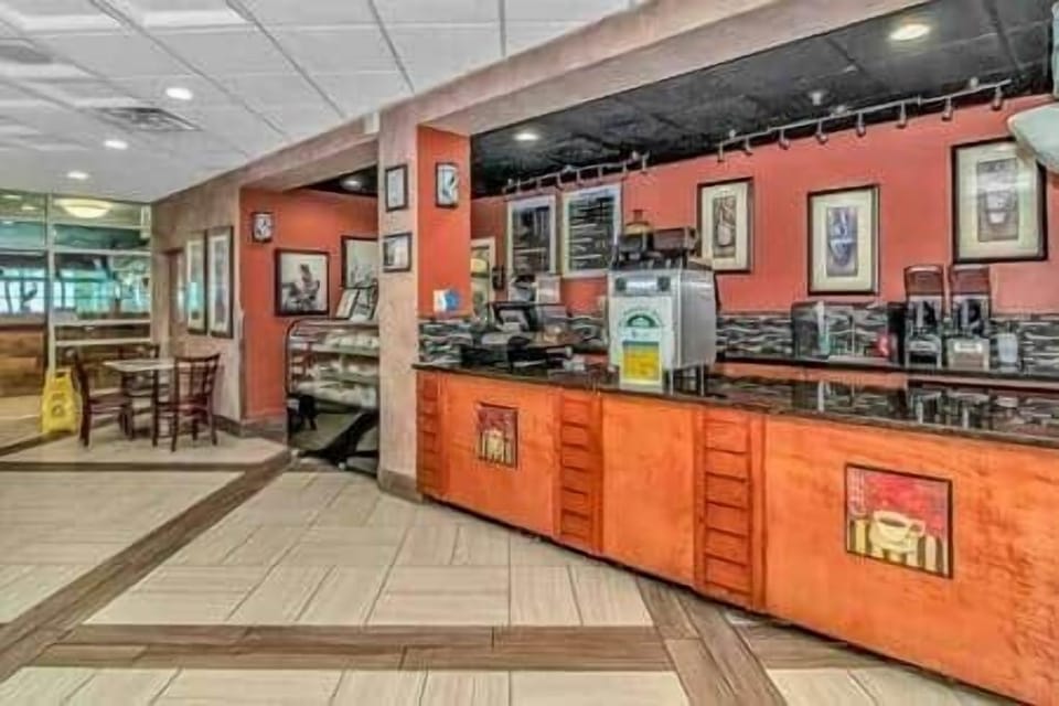 On-Site Coffee Shop Serving Breakfast & Snacks Convenient café offering coffee, pastries, and quick 