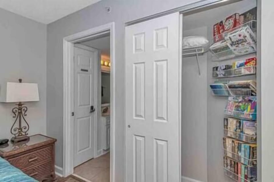 Master bedroom closet stocked with lots of books, games and cards for guests to enjoy!