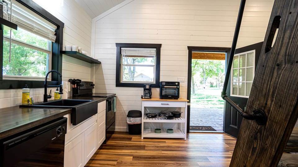 Kitchen equiped w/ full size appliances 
 basic cooking essentials & coffee bar.
