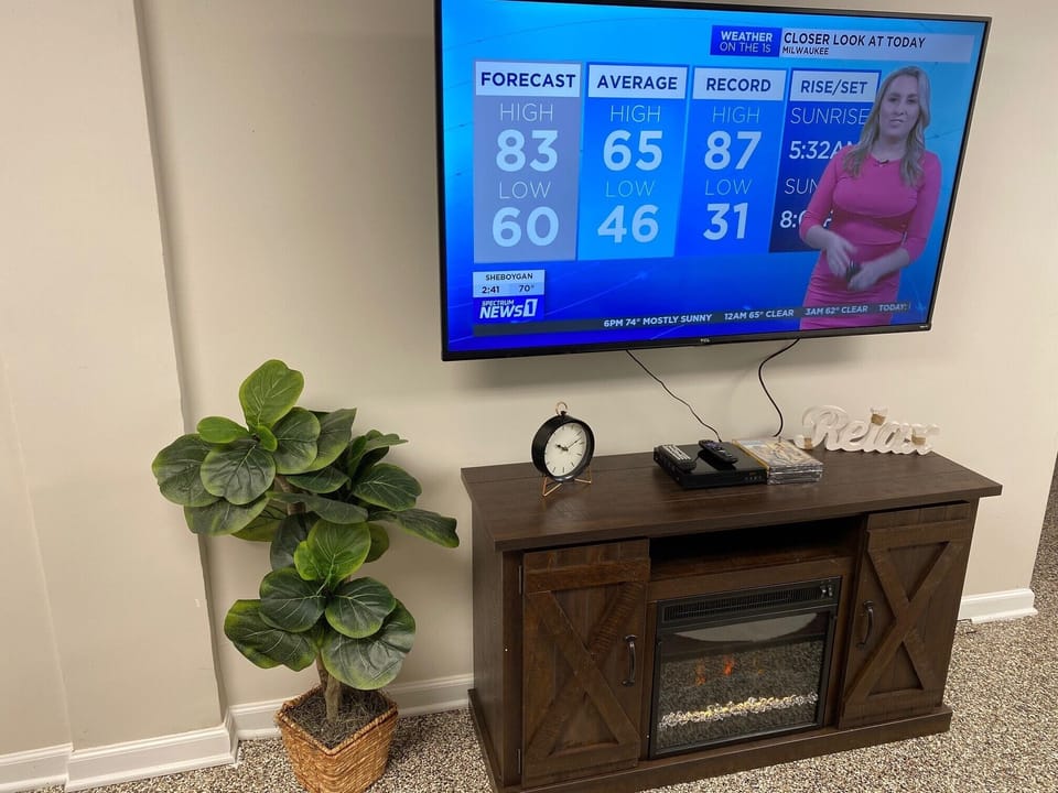 Nice size living room with the new 55" Smart TV and Electric Fireplace