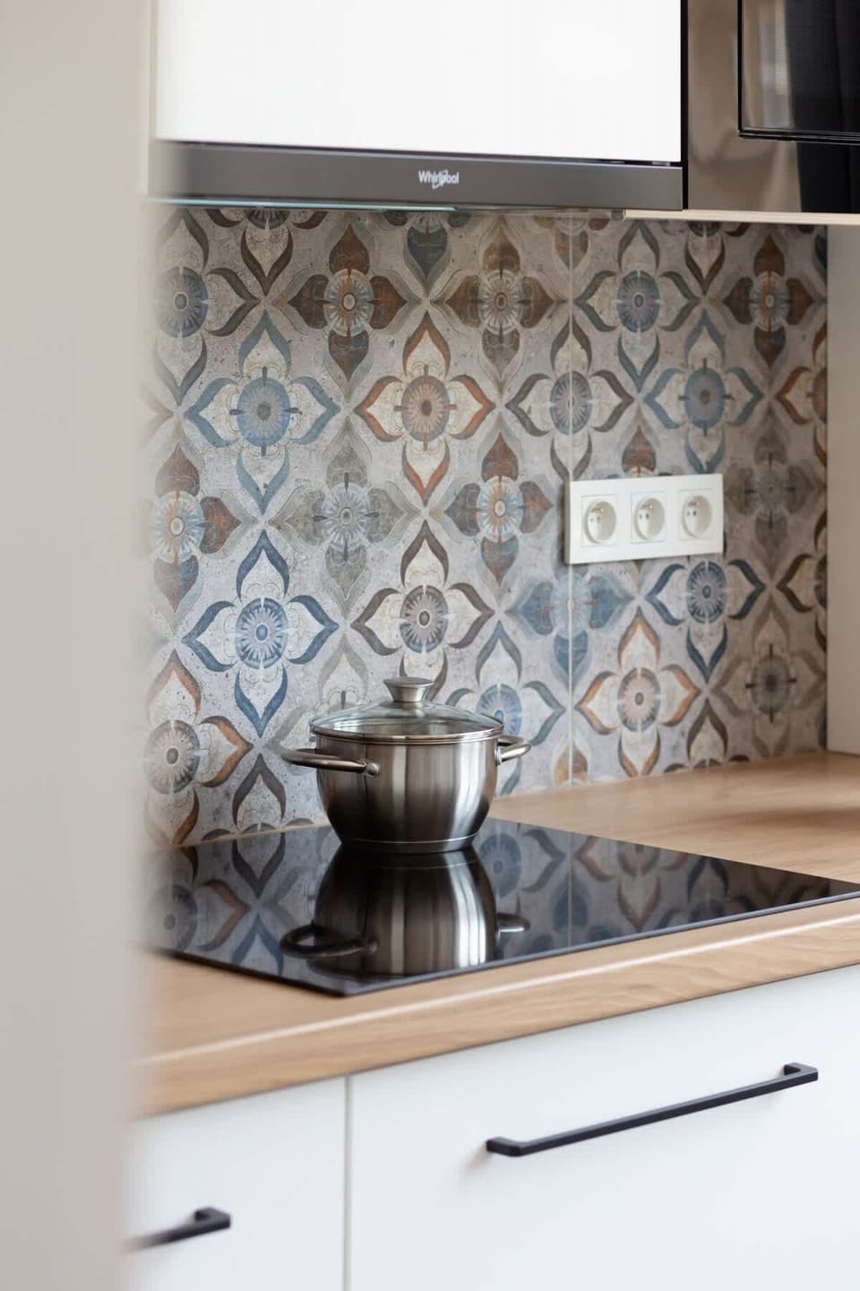 The kitchen offers a functional layout for convenient cooking. 