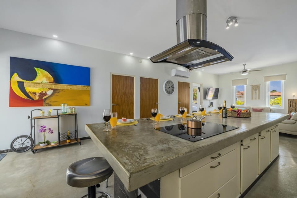 The full kitchen has a large kitchen counter that adds more dining space for your family.