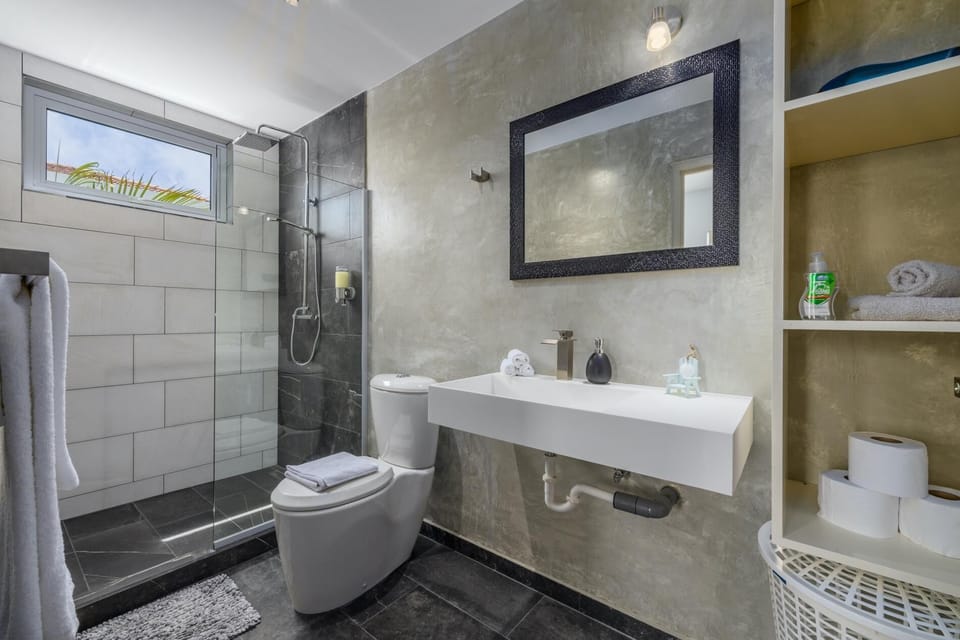 An elegant bathroom design complete with amenities.