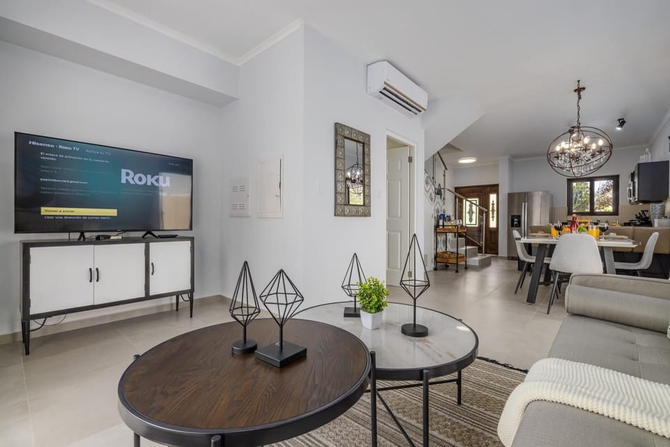 Relax while watching your favorite movie on this Roku TV in the living room.