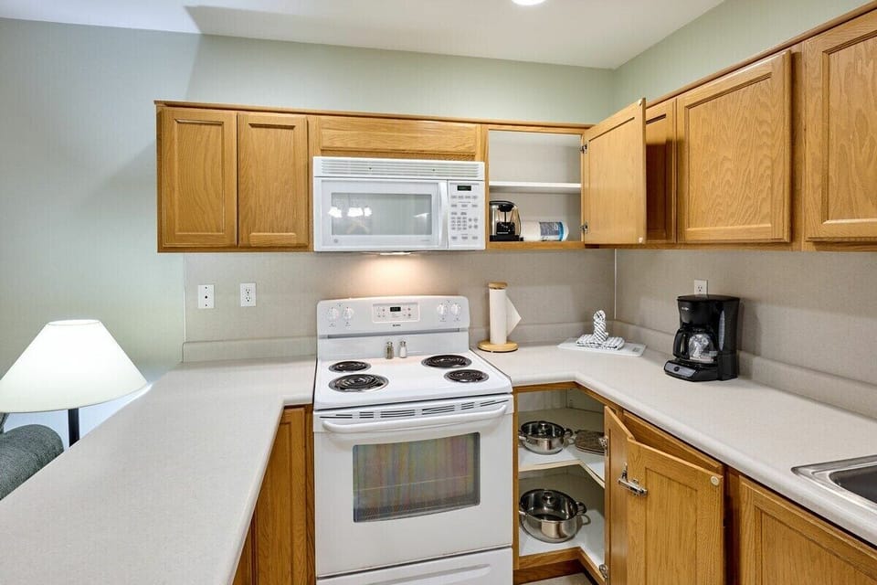 The kitchen comes fully stocked with silverware and appliances