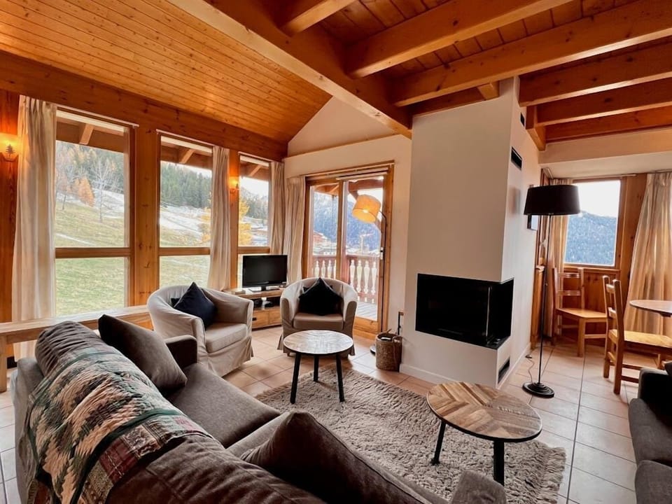 Lounge view over the piste with an open fire