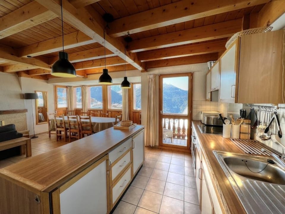 Fully equipped kitchen with balcony access and stunning views