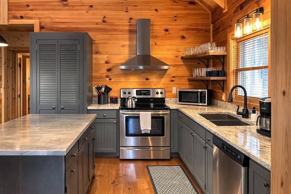 A freshly updated, fully stocked kitchen with rustic charm and modern touches—open shelving, stainless appliances, and all the essentials you need to cook, gather, and feel right at home.
