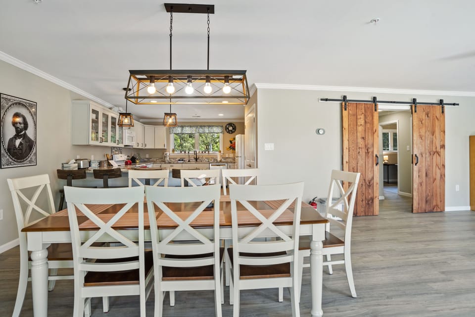 3rd floor dining table for 8 with 4 bar stools at counter.
