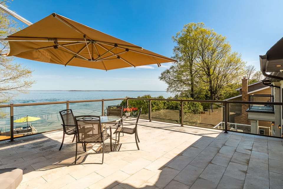 The balcony off the second-floor bedroom has a fantastic view & patio furniture.