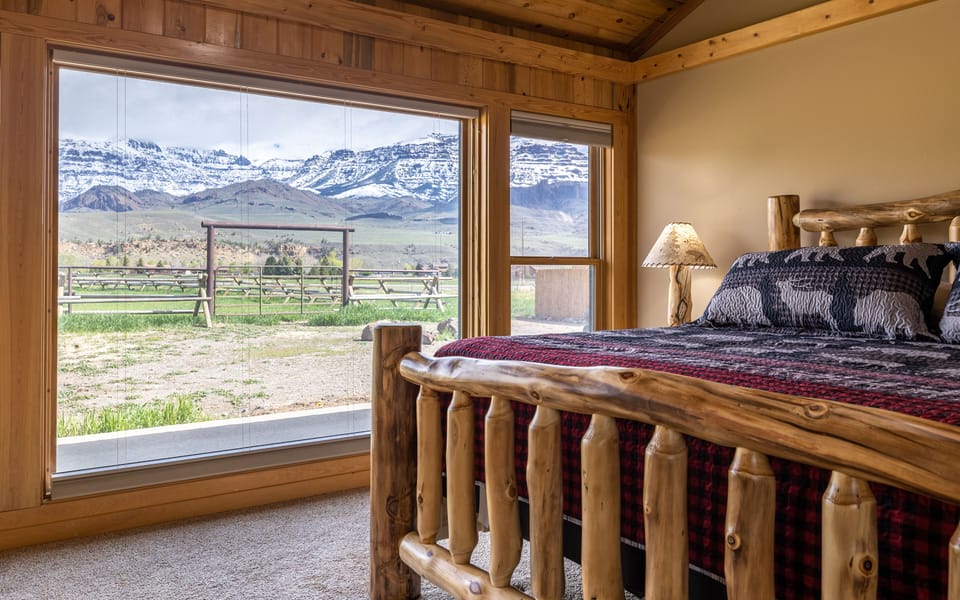 Main Bedroom suite with King Bed and lodgepole frame has peaceful views