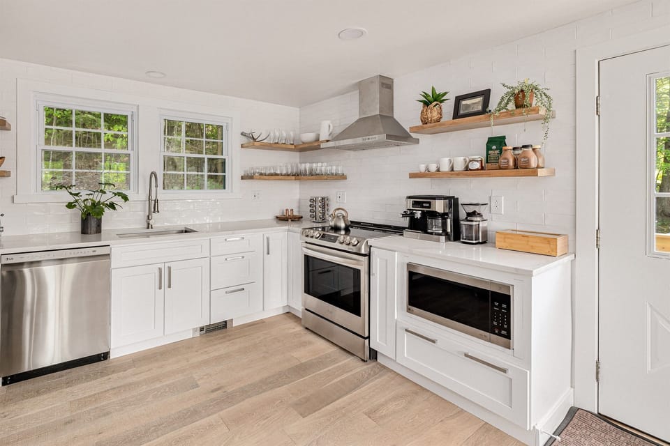 You'll find everything you need to cook or bake here! All appliances are LG stainless steel; glass front fridge, induction cooktop and oven, microwave, ultra-quiet dishwasher and Smeg toaster