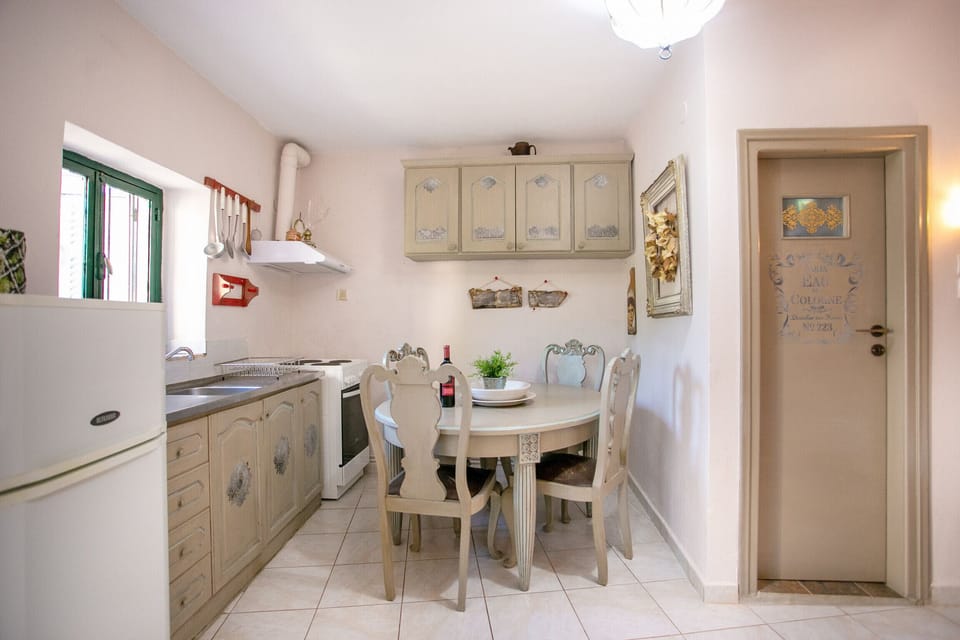 Kitchen and dining table of Cozy country house,4 guests,Renovated,Near tavern,cafe, beach,Mani,Greece