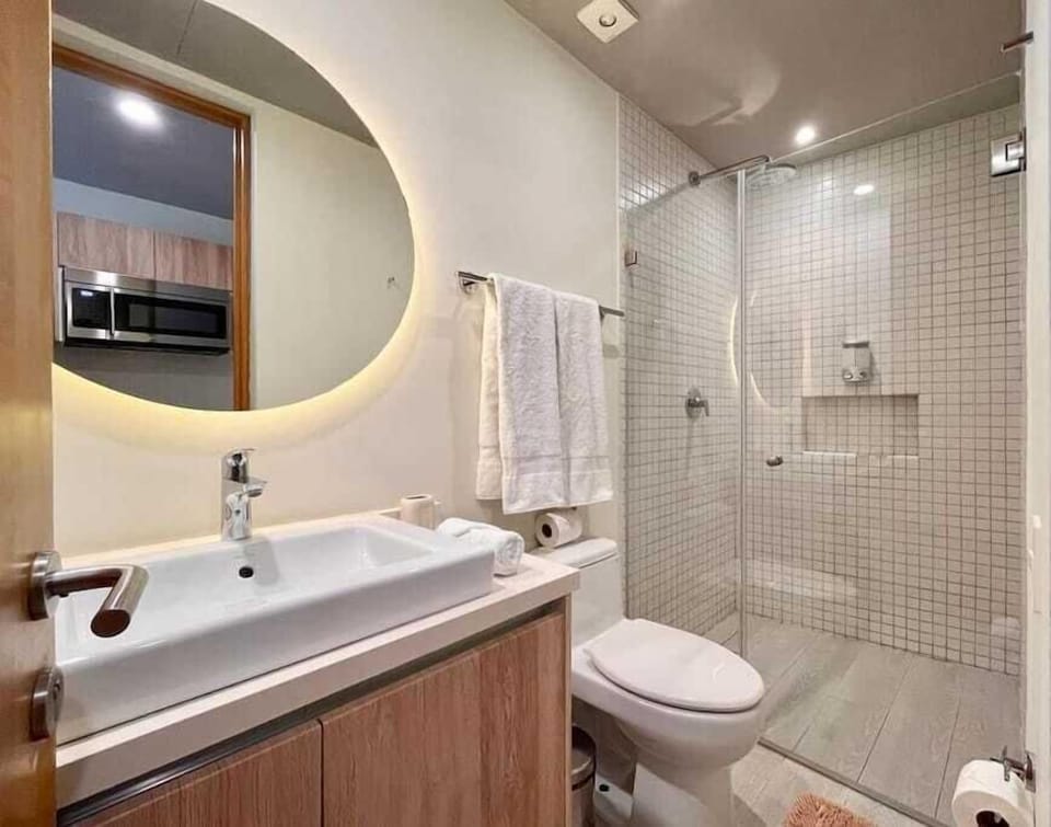 Full bathroom with vanity and shower