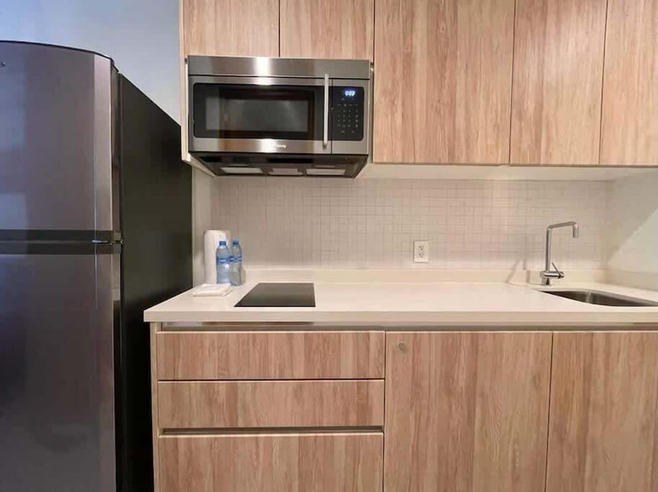 Kitchenette with stovetop and microwave