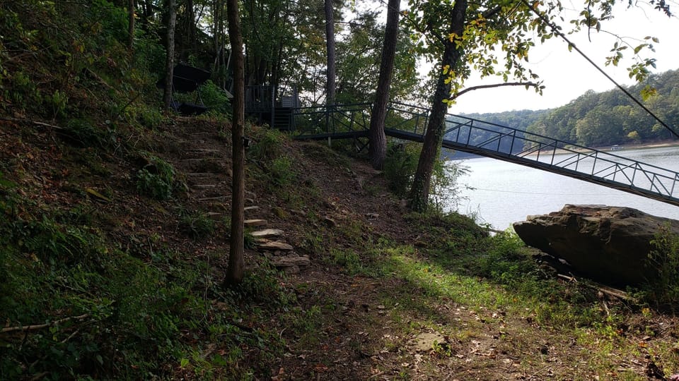 step from access road to boat dock ramp