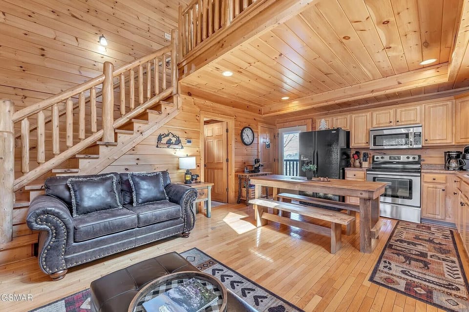 Great room open to the kitchen and views to the back valley view.