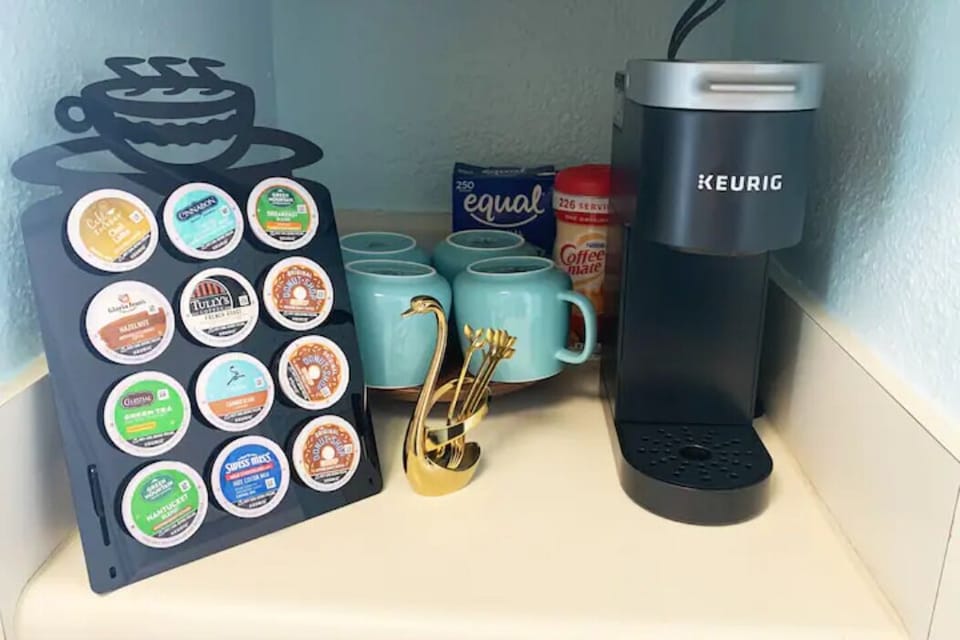 Keurig coffee maker, mugs, variety coffee pods (we do has decaf), sugar, creamer