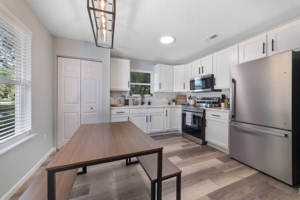 The kitchen has brand new stainless steel appliances and comes fully stocked.