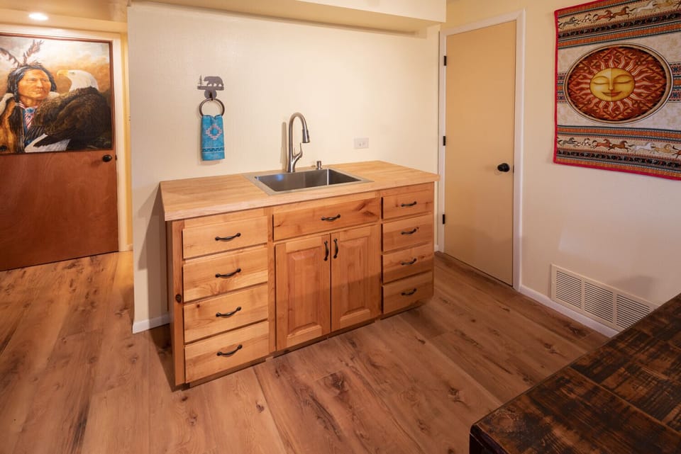 Kitchenette sink and cabinets