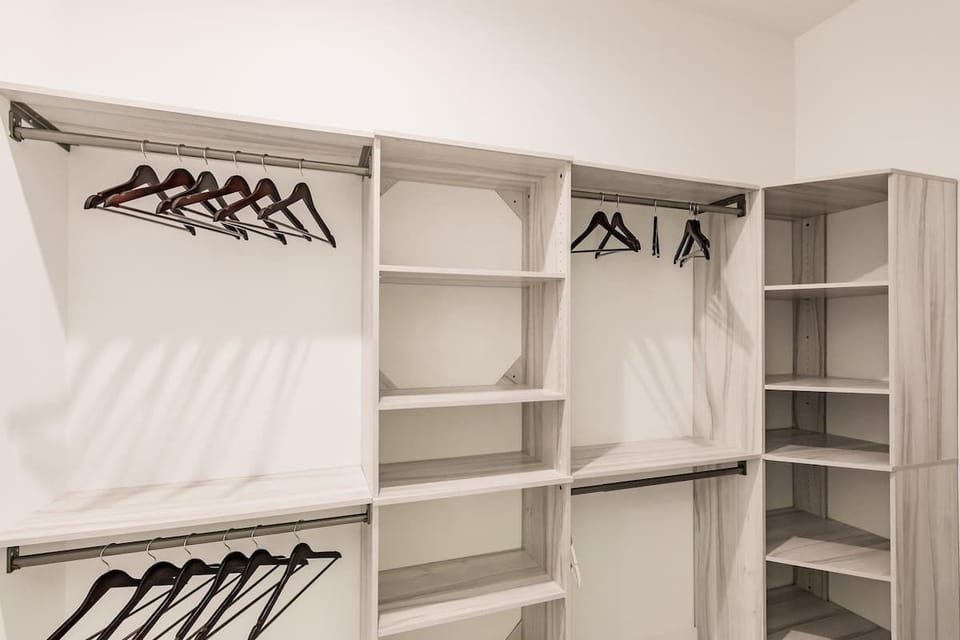 The closets are equipped with plenty of space and hangers to accommodate your beach wardrobe! | Coastal Sol by Boutiq Luxury Vacation Rentals | Naples, Florida