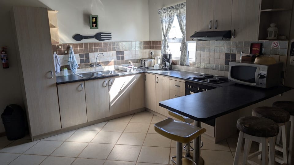 Family Apartment | Private kitchen | Coffee/tea maker, fridge, shared microwave, electric kettle