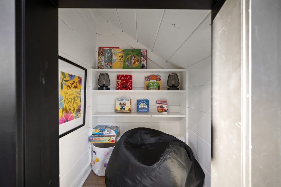 The little ones will love their reading hideout under the stairs.