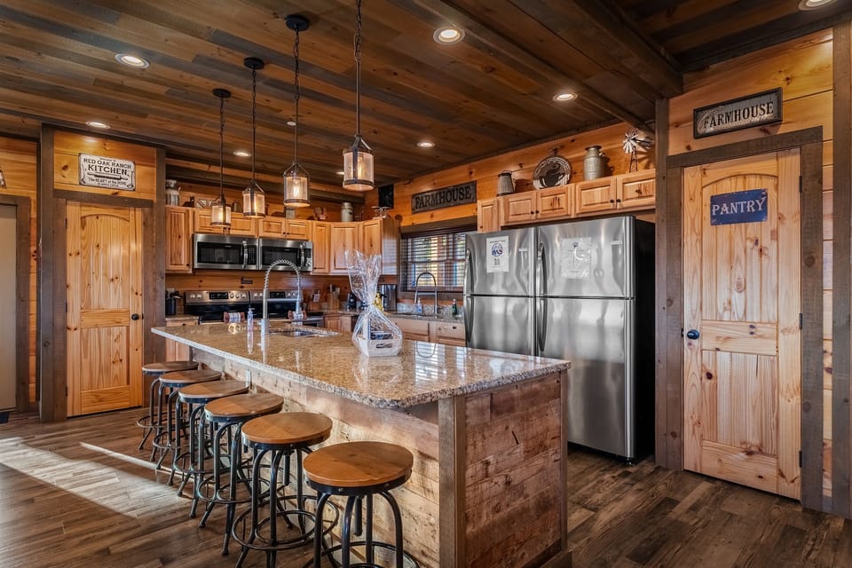 Island is over 10 feet Long with lots of bar stools. Double appliances for all your cooking needs.