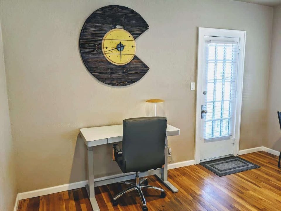 NEW! Sit/stand electronic desk with a built-in wireless charger, usb ports, and a comfortable office chair. Catch up on work or keep working with a change of scenery in Colorado Springs!
