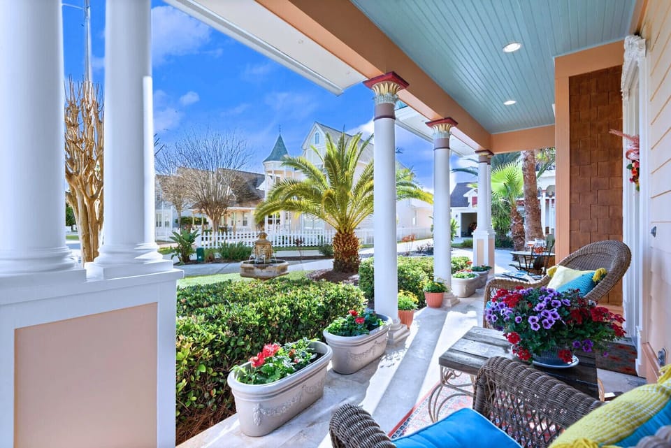 Front Porch Bliss – Relax on the front porch with seating, overlooking a peaceful water fountain.
