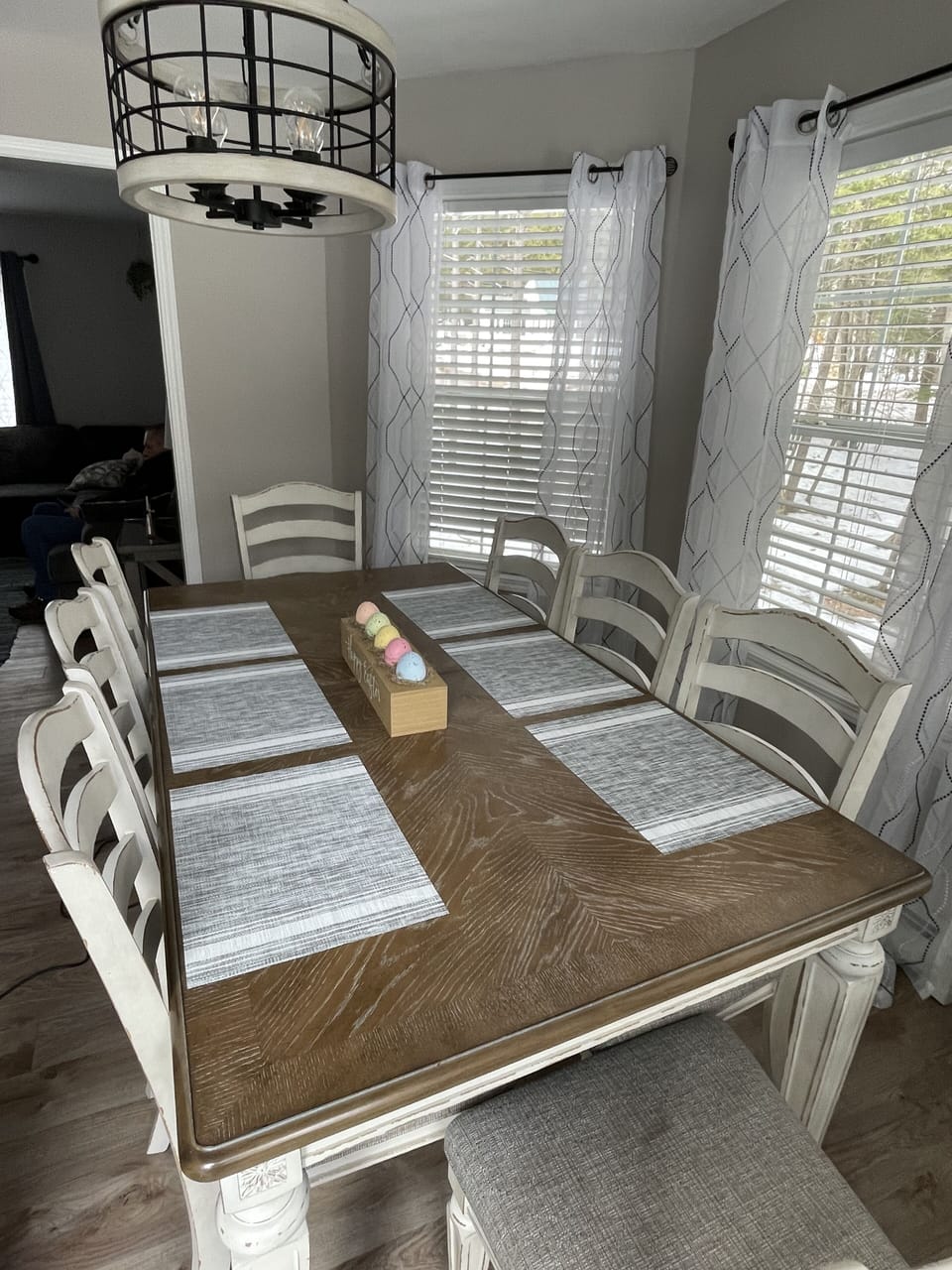 Dining table sits 8.  2 more seats at the breakfast bar.