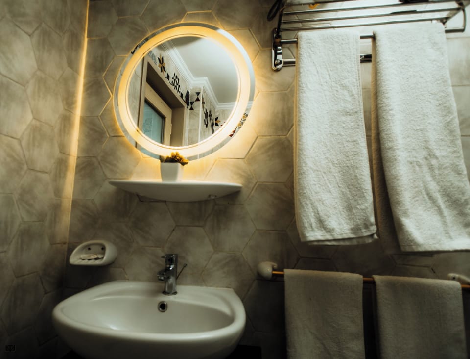 Premium Quadruple Room, Non Smoking, Mountain View | Bathroom | Shower, slippers, bidet, towels