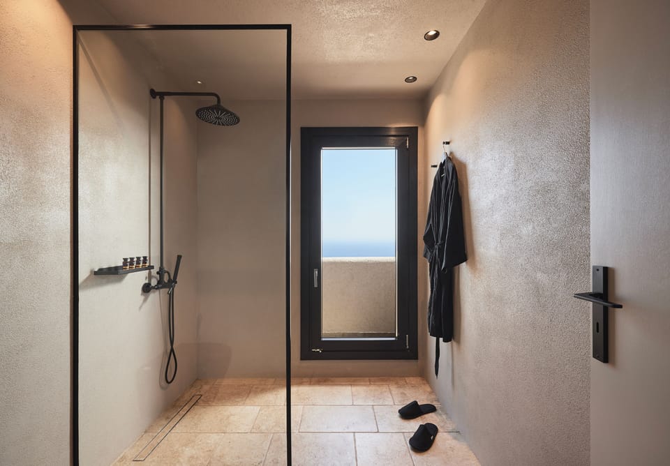Junior Suite, Sea View | Bathroom | Shower, slippers, towels