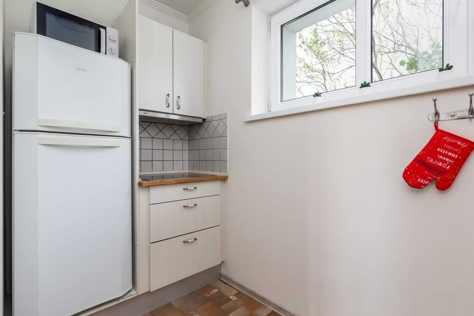 The kitchen is fully equipped with high-quality appliances for all your culinary needs.