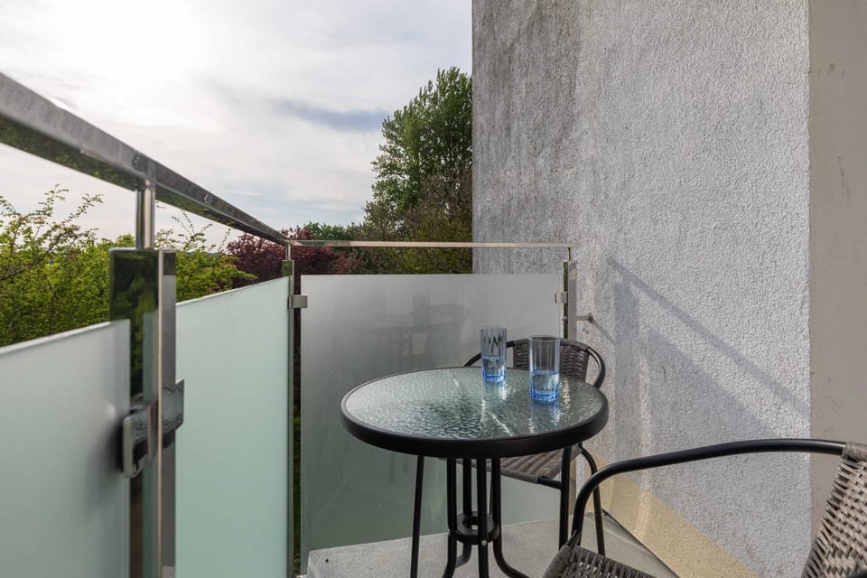 Relax on the balcony's comfortable chairs and enjoy the fresh air.