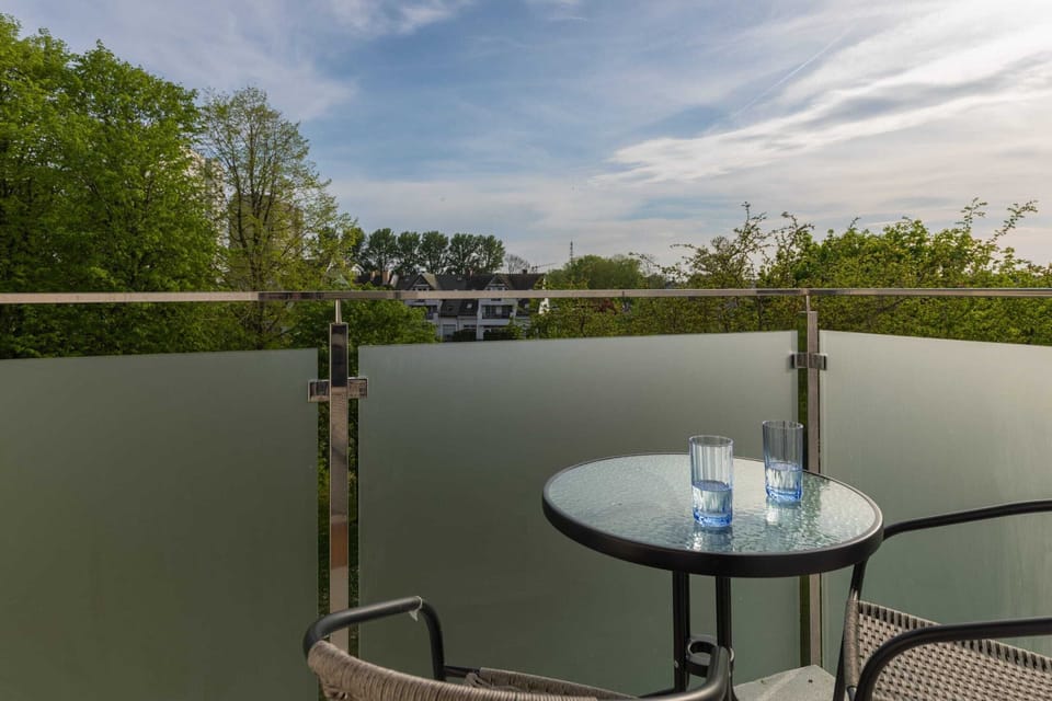 A small table on the balcony is ideal for outdoor dining or working.