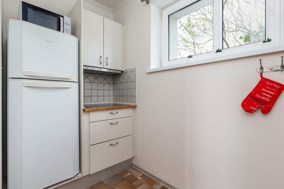 The kitchen is fully equipped with high-quality appliances for all your culinary needs.