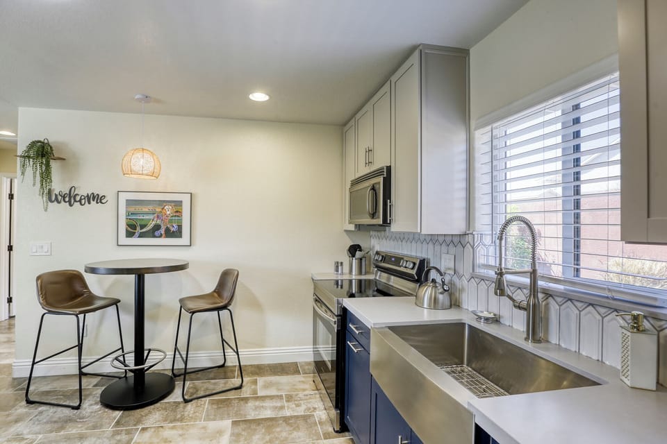 kitchen and dining area with bistro table and chairs