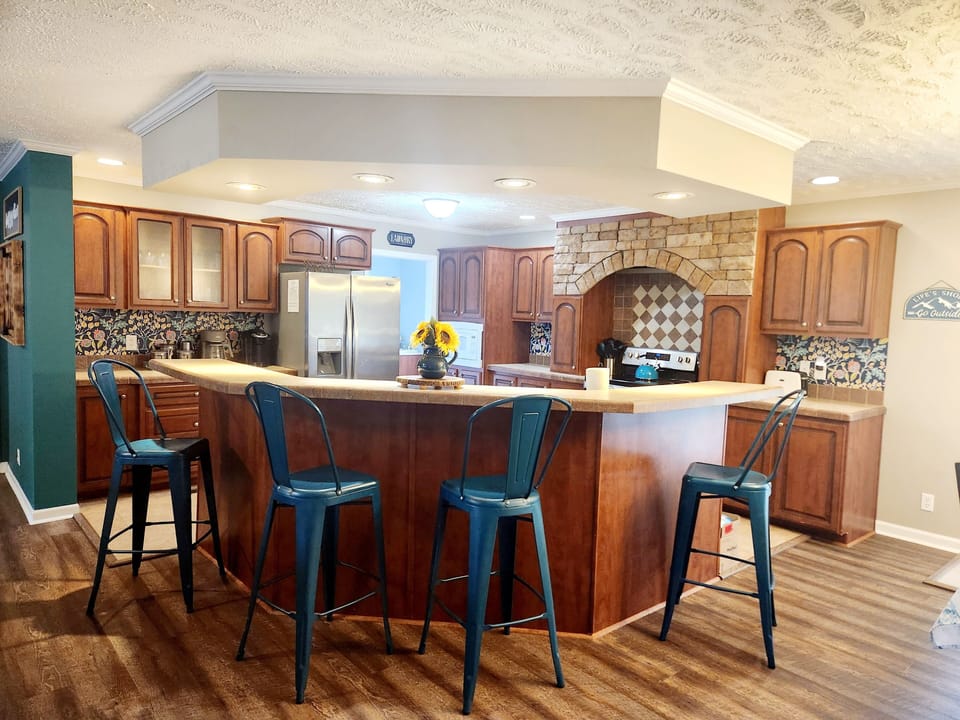 Large open concept kitchen with a bar for sitting or serving!