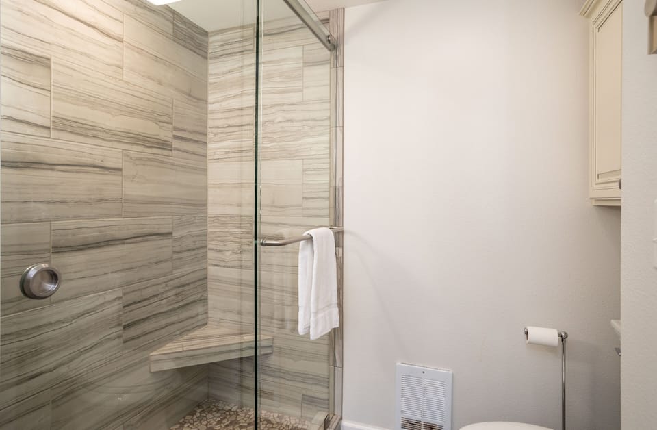 The new, walk-in shower is so luxurious.