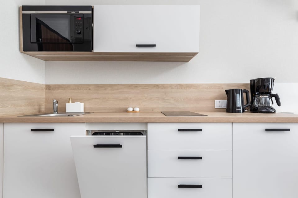 The fully equipped kitchenette includes everything you need for a home-cooked meal.