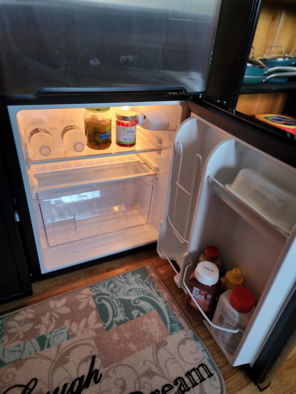 Refrigerator freezer in kitchen.
