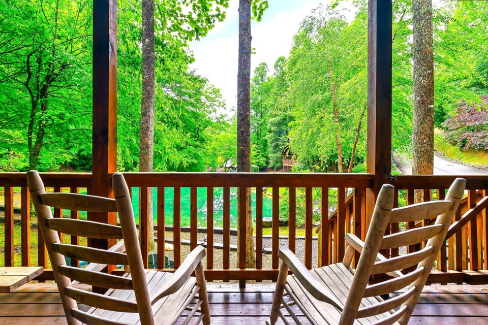 Unwind in the rocking chairs overlooking peaceful water views and lush Smoky Mountain greenery — a quiet spot to slow down and soak in nature.